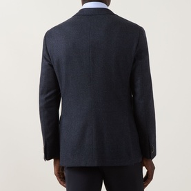 Model wearing Corneliani dark blue 100% wool jacket, rear view, styled with white shirt and navy trousers
