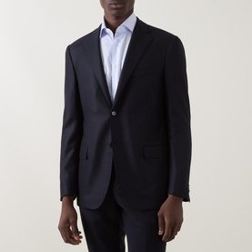 Model wearing Corneliani navy virgin wool and cashmere blend single-breasted jacket, styled with a light blue dress shirt.