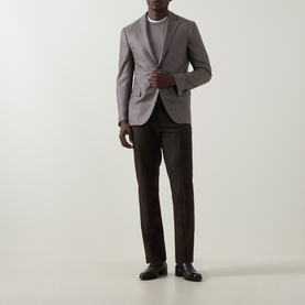 Model wearing Corneliani stone wool-cashmere blazer jacket, styled with white crew-neck tee, dark brown trousers and black leather shoes.