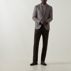Model wearing Corneliani stone virgin wool cashmere blazer, styled with dark brown trousers and black leather shoes.