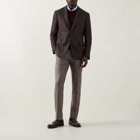 Model wearing Corneliani brown wool blazer jacket, styled with burgundy knit, grey trousers and dark loafers