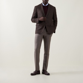 Model wearing Corneliani brown virgin wool jacket, styled with matching trousers, burgundy jumper, white shirt and dark leather shoes.