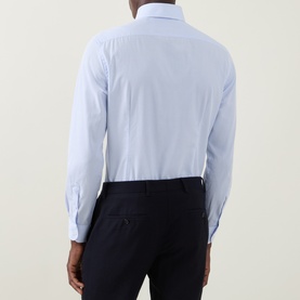 Model wearing Corneliani blue single cuff regular cotton formal shirt, back view, styled with navy trousers
