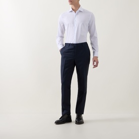 Model wearing Corneliani Poplin Polkadot Formal Shirt in white with navy trousers and black leather shoes.