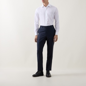 Model wearing Corneliani white cotton single cuff regular shirt, styled with navy tailored trousers and black leather oxford shoes.