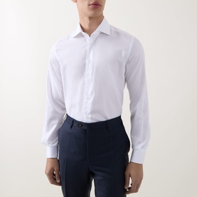 Model wearing Corneliani white single cuff regular shirt in 100% cotton, styled with navy dress trousers