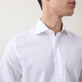 Model wearing Corneliani white single cuff regular formal shirt in 100% cotton, close-up of spread collar detail