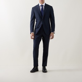 Model wearing Corneliani white single cuff regular shirt styled with navy suit, tie, and black dress shoes.