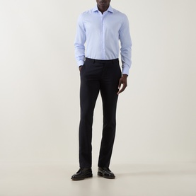 Model wearing Corneliani blue single cuff regular cotton formal shirt, styled with navy tailored trousers and black leather shoes.