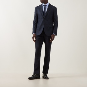 Model wearing Corneliani blue single cuff regular cotton formal shirt, styled with navy suit and dark tie.