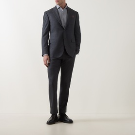 Model wearing Corneliani Flannel Two-Piece Suit in grey, single-breasted jacket with notch lapel, styled with a light shirt and black shoes.