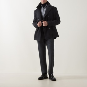 Model wearing Corneliani Flannel Two-Piece Suit in grey, styled with a dark overcoat, black turtleneck, and black leather shoes.