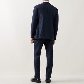 Model wearing Corneliani Micro-Weave Two-Piece Suit in navy, rear view, styled with black leather loafers.