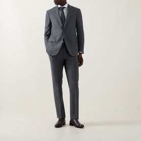 Model wearing Corneliani grey wool suit with white shirt, grey tie and dark leather Oxford shoes.