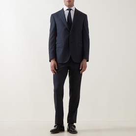 Model wearing Corneliani Tonal Herringbone Two-Piece Suit in dark blue, styled with white shirt, tie and black leather shoes.