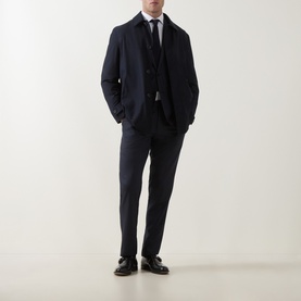 Model wearing Corneliani Tonal Herringbone Two-Piece Suit in dark blue, styled with a white shirt, tie, and dark leather shoes.