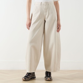 Model wearing Damson Madder Erika Barrel Leg Jeans in stone, wide barrel-leg silhouette, styled with dark chunky trainers.