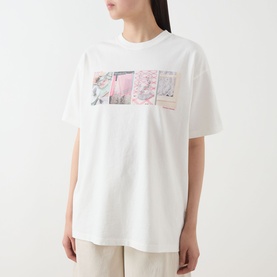 Model wearing Damson Madder off white cotton T-shirt with pink and green floral photo-print graphic panel at chest
