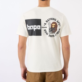 Model wearing BAPE A Bathing Ape Logo T-Shirt in ivory, showing back graphic with square logo and circular Ape Head print, styled with khaki trousers.
