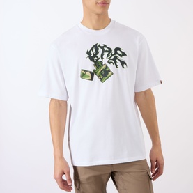 Model wearing BAPE Lighter Relaxed Fit T-Shirt in white with flame and lighter graphic print, styled with khaki trousers