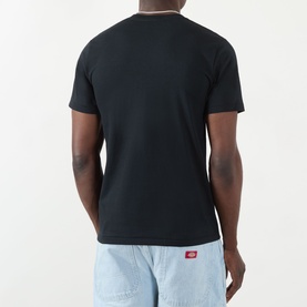 Model wearing BAPE Groovy Justice Logo T-Shirt in black, back view, styled with light blue denim shorts