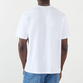 Model wearing BAPE Spray Ape Head Logo T-Shirt in white, back view, round neck, short sleeves, styled with blue jeans