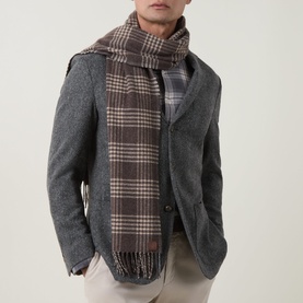 Model with Eleventy scarf in brown, sand and mid-grey check, draped over grey wool blazer, fringed hem detail visible