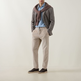 Model wearing Eleventy blue cotton casual shirt, styled with grey blazer, mauve scarf and beige trousers