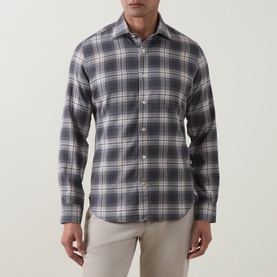 Model wearing Eleventy dark grey large plaid check cotton casual shirt with long sleeves and spread collar, styled with beige trousers