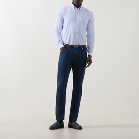 Model wearing Eleventy light blue cotton casual shirt, styled with navy trousers, brown belt and black loafers.
