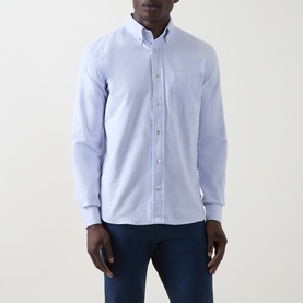 Model wearing Eleventy light blue cotton casual shirt with button-down collar and chest pocket, styled with navy trousers
