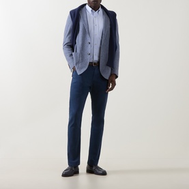 Model wearing Eleventy light blue cotton casual shirt, styled with navy blazer, navy trousers, and black loafers.
