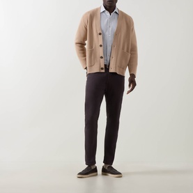 Model wearing Eleventy Grigio Chiaro Melange cotton casual shirt, styled with camel cardigan, dark navy trousers and grey trainers.