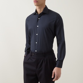 Model wearing Eleventy Dandy Casual Shirt in blu, pointed collar, long sleeves, white buttons, styled with dark tailored trousers.