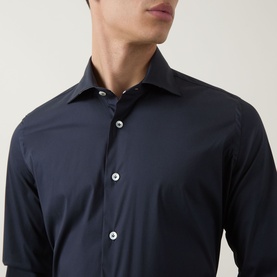 Model wearing Eleventy Dandy Casual Shirt in blu, featuring pointed collar and button fastenings, slim stretch fit visible at chest.