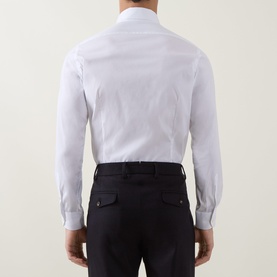 Model wearing Eleventy white casual shirt, rear view, with dark navy trousers. Slim fit, long sleeves with button cuffs.