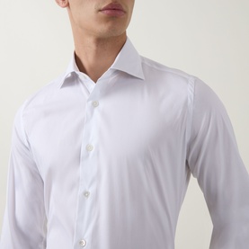 Model wearing Eleventy white casual shirt in cotton blend, featuring spread collar and button placket, close-up detail view.