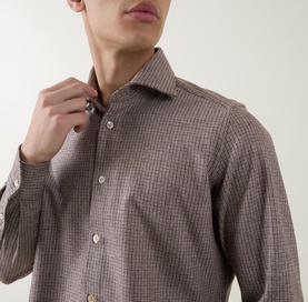 Model wearing Eleventy Dandy Houndstooth Shirt in burgundy, styled under a grey knit and dark brown blazer.