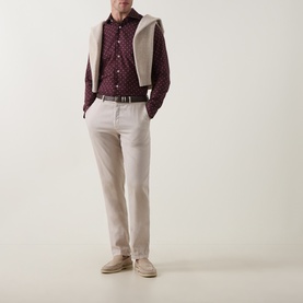 Model wearing Eleventy Barolo e Sabbia casual shirt with printed pattern, styled with cream gilet and light taupe trousers