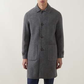 Model wearing Eleventy mid-grey melange wool coat with button front, patch pockets, and classic collar, styled with dark trousers.
