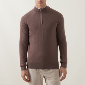 Model wearing Eleventy cashmere half-zip jumper in moro e sabbia, styled with light taupe trousers.
