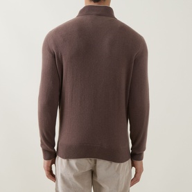 Model wearing Eleventy cashmere half-zip knit in Moro E Sabbia, rear view. Styled with light beige trousers.