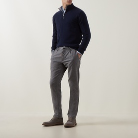 Model wearing Eleventy Cashmere Half-Zip Sweater in blue with contrast collar, styled with grey trousers and brown suede shoes.
