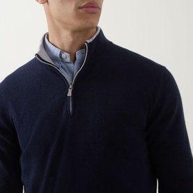 Model wearing Eleventy Cashmere Half-Zip Sweater in navy blue with grey contrast zip collar, styled over a light blue shirt.