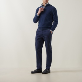Model wearing Eleventy royal blue cashmere half-zip jumper, styled with navy trousers and a check shirt, black loafers.