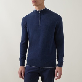 Model wearing Eleventy royal blue cashmere half-zip jumper with light grey zip detail, styled with matching navy trousers.