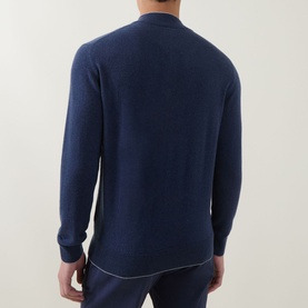 Model wearing Eleventy royal blue cashmere half-zip jumper, back view, with light grey contrast trim detailing at hem.