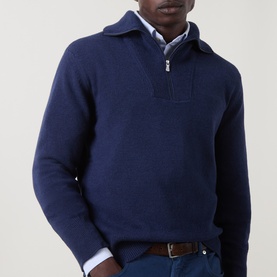Model wearing Eleventy Dark Blue wool half-zip jumper, styled with a light blue shirt and brown belt.