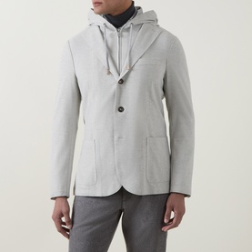 Model wearing Eleventy hooded blazer jacket in grigio chiaro melange, styled with grey trousers and dark roll-neck top