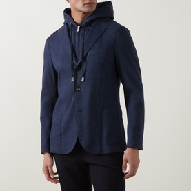 Model wearing Eleventy blue hooded blazer jacket with drawstring hood detail and two-button front, styled with black trousers